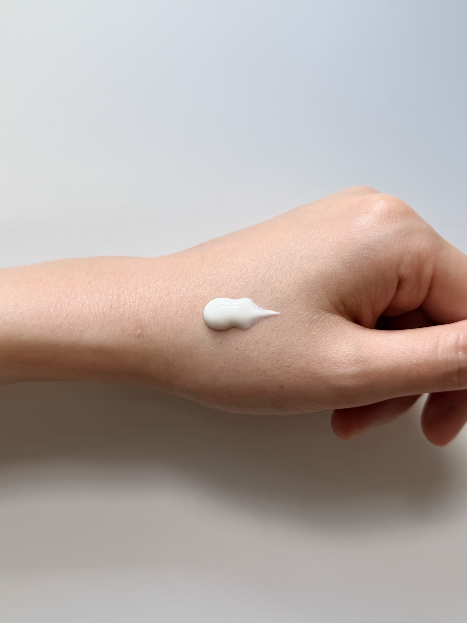 AHC Aqua Rich Sun Cream texture on hand — thicker, richer consistency before spreading