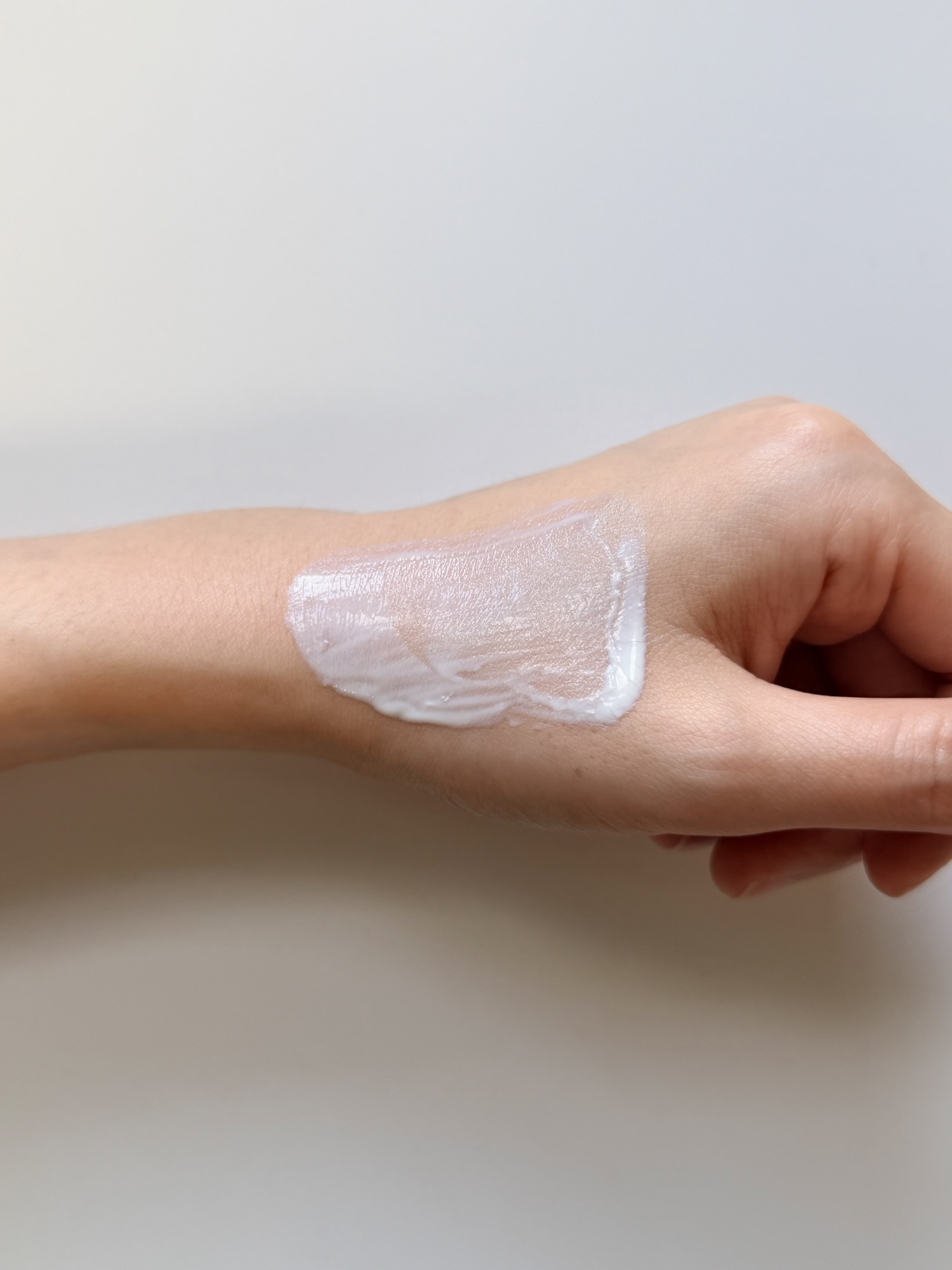 AHC Aqua Rich sunscreen blended on hand — balanced rich hydration with clean finish