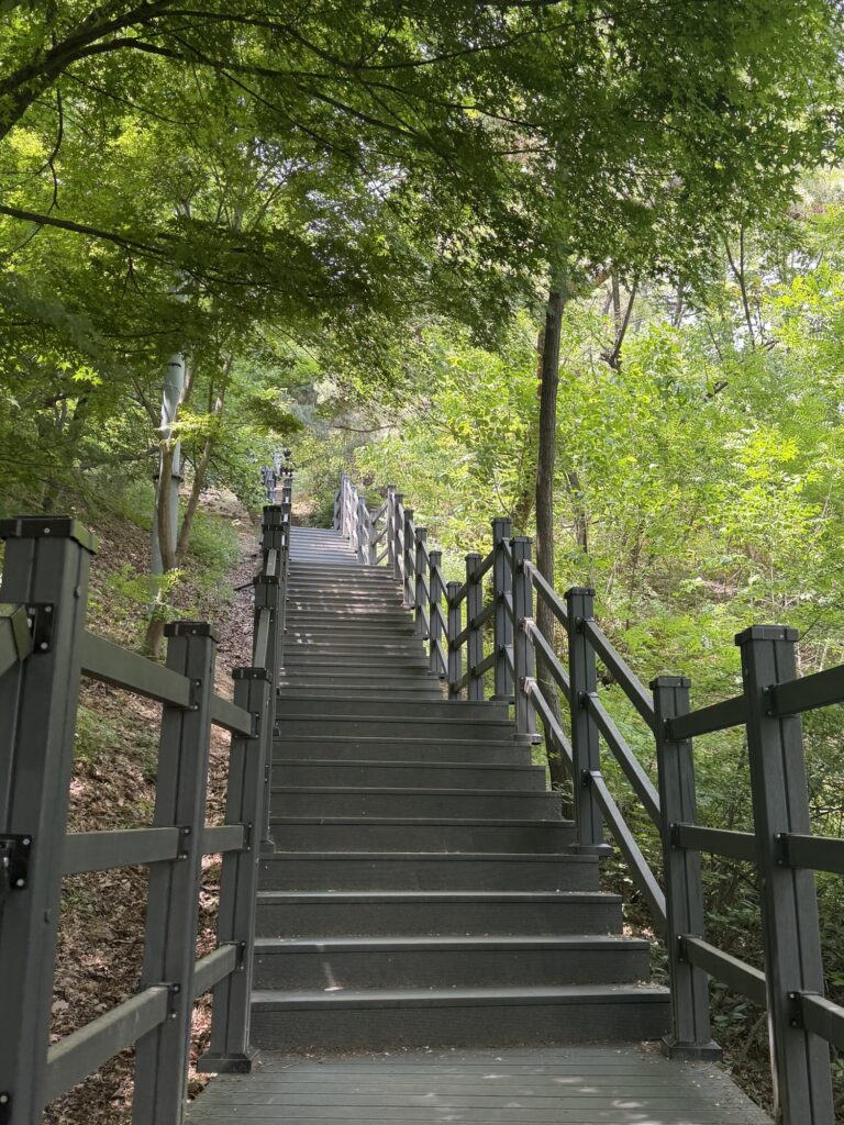 Long stone staircase at the start of the Inwangsan trail, hikers ascending
