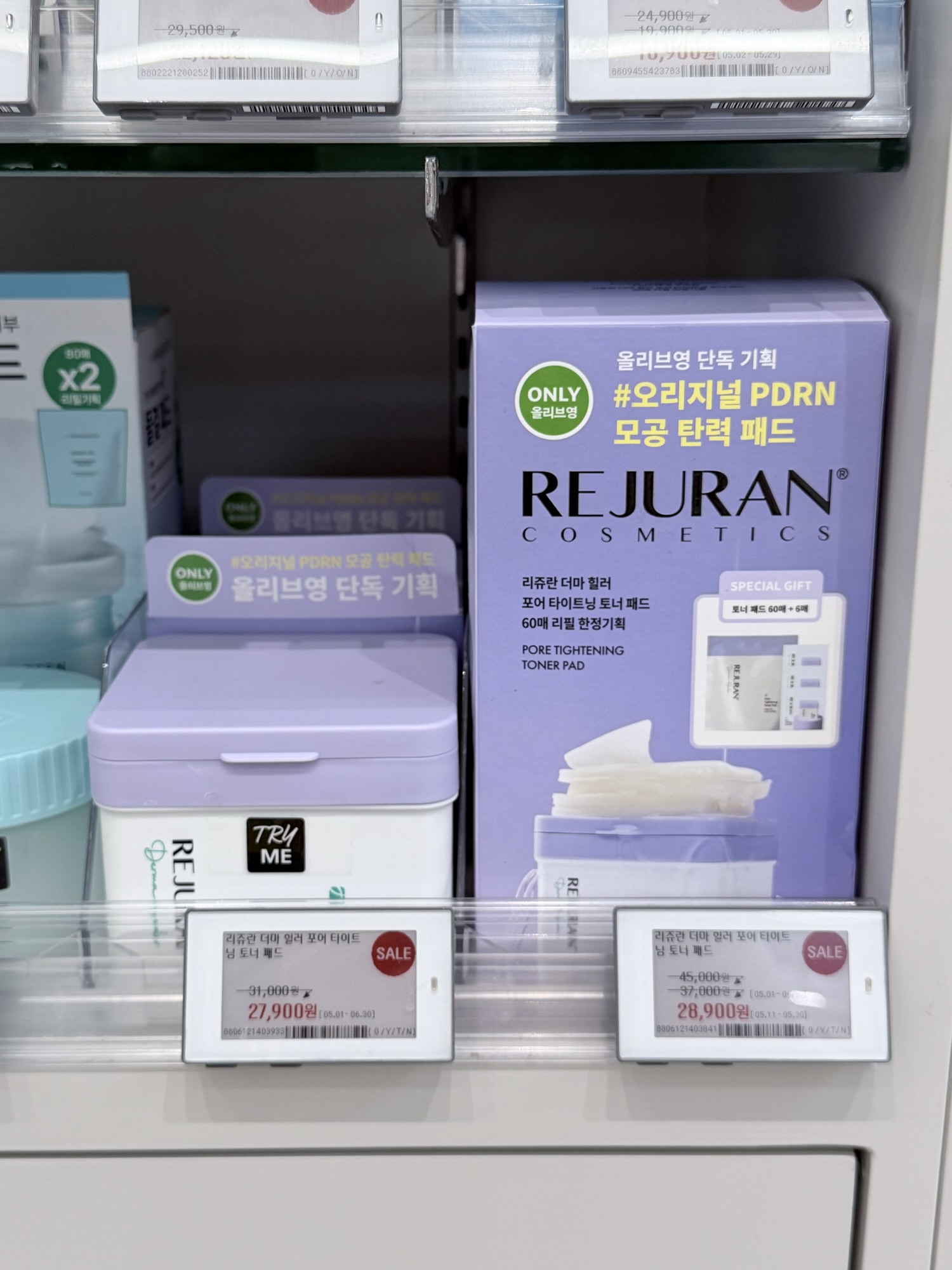 Rejuran Pore Tightening Toner Pad on Olive Young sale shelf — 60-pad single and 126-pad double set side by side