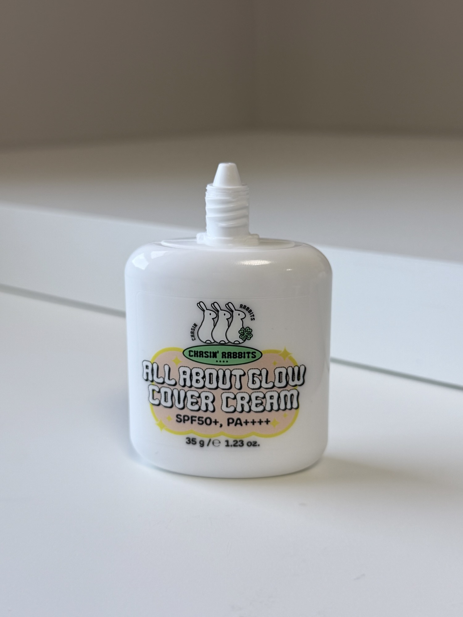 Open Chasing Rabbit Glow Cover Cream bottle with narrow nozzle for controlled dispensing
