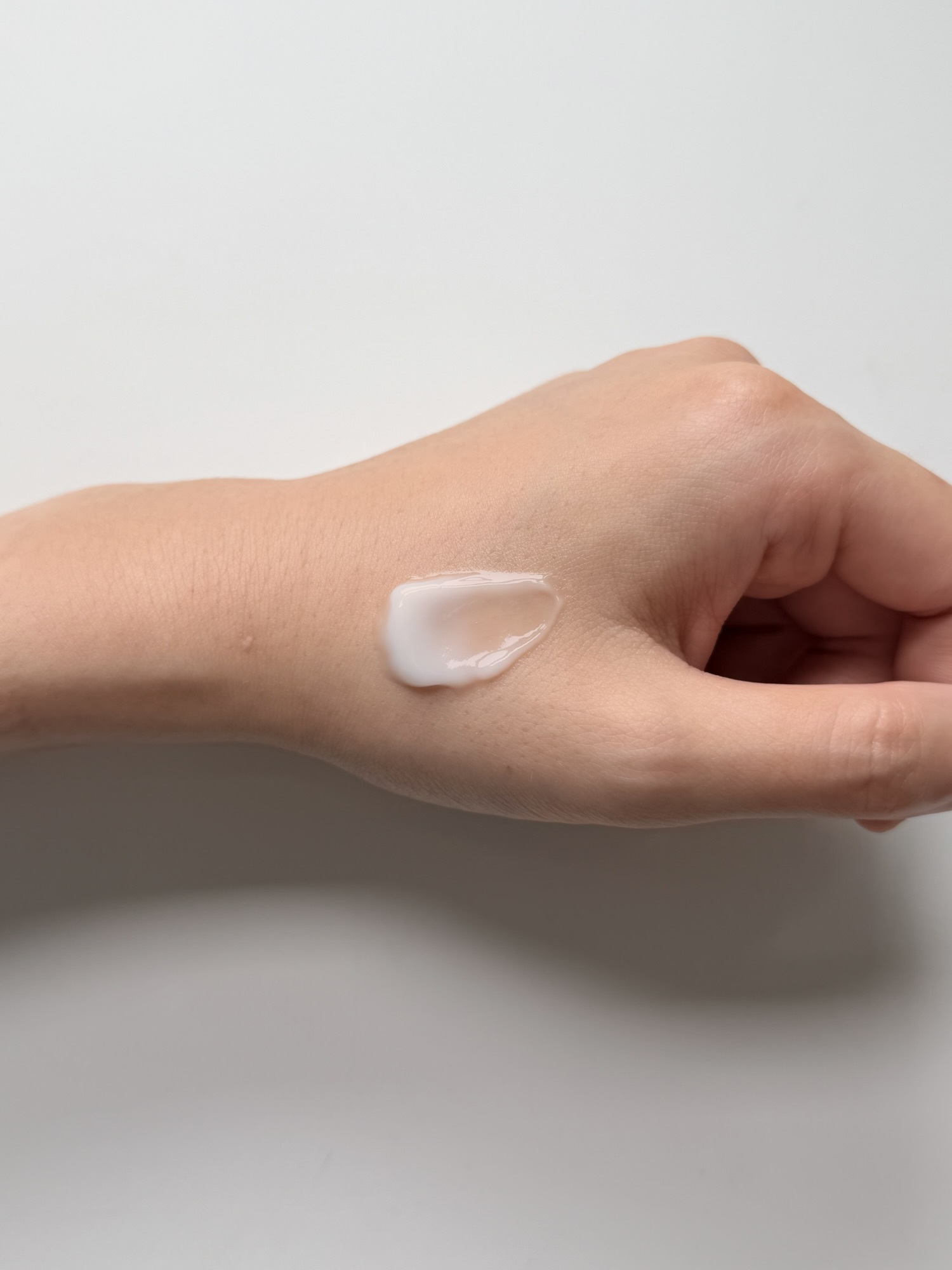 Single dab of Torriden Balanceful Cica Cream on the back of a hand before blending out