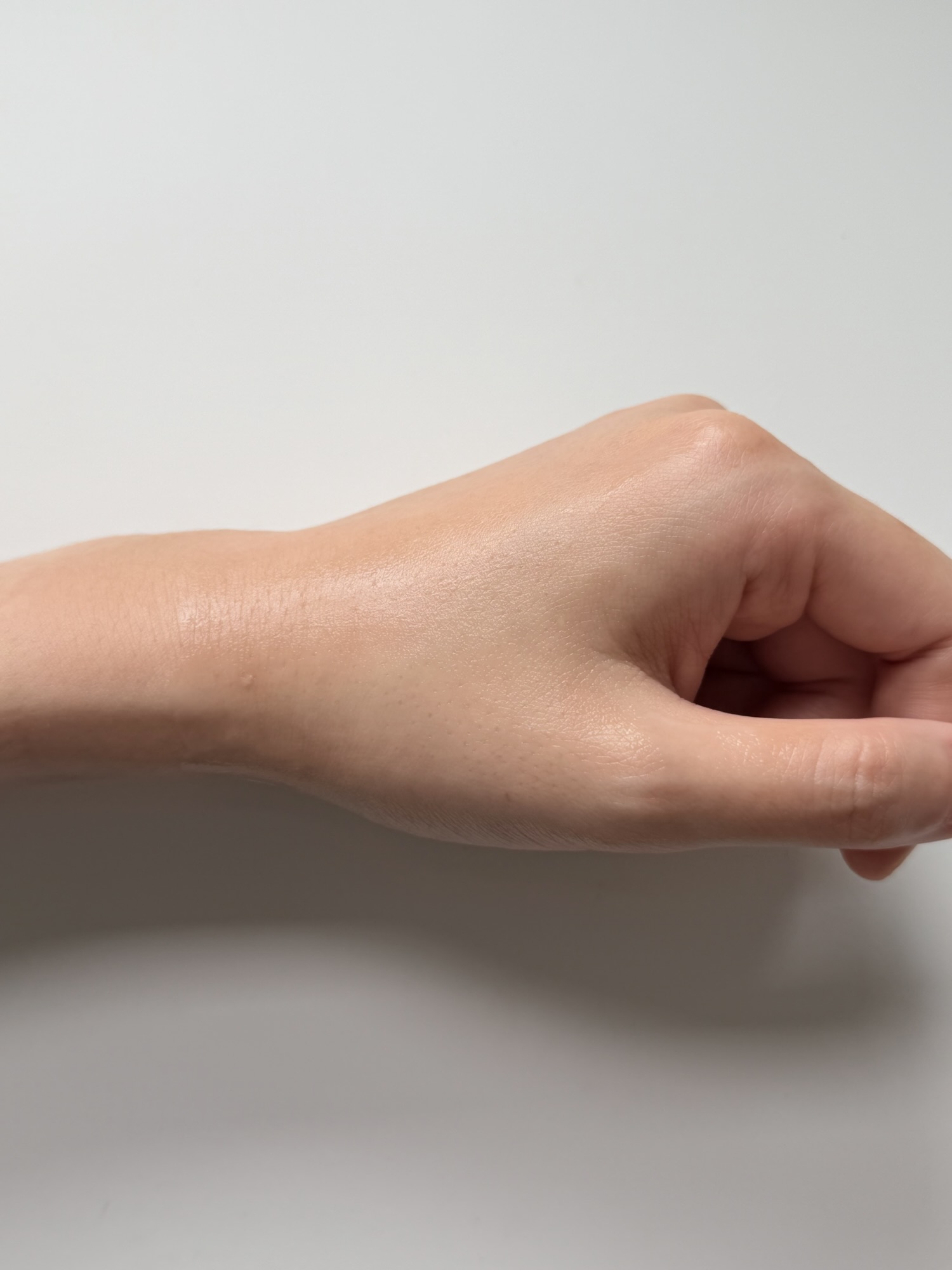 Back of a hand after Torriden Balanceful Cica Cream has fully absorbed with a light, non-shiny finish