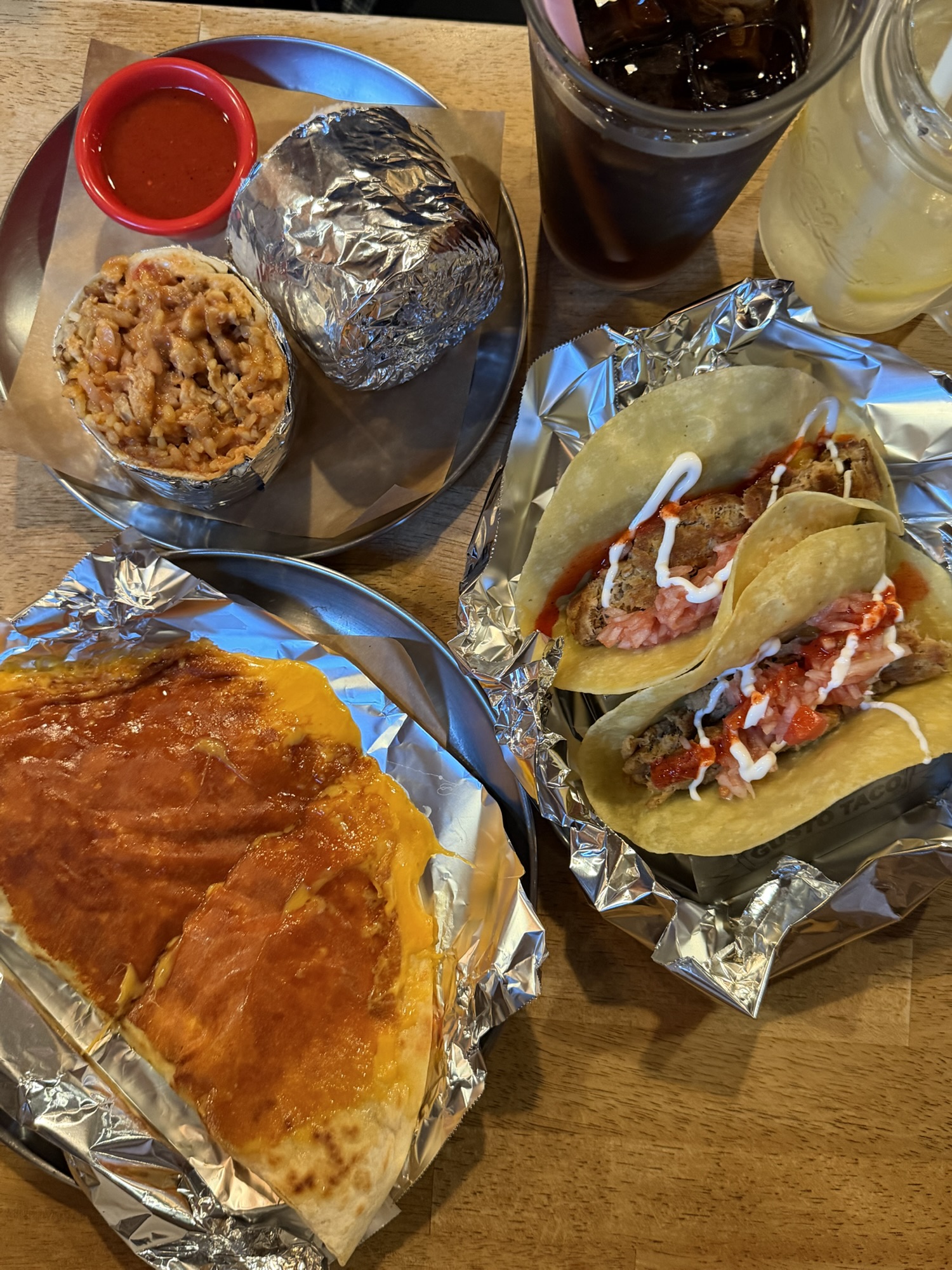 Full Gusto Taco couple set with tacos, quesadilla, burrito, and drinks