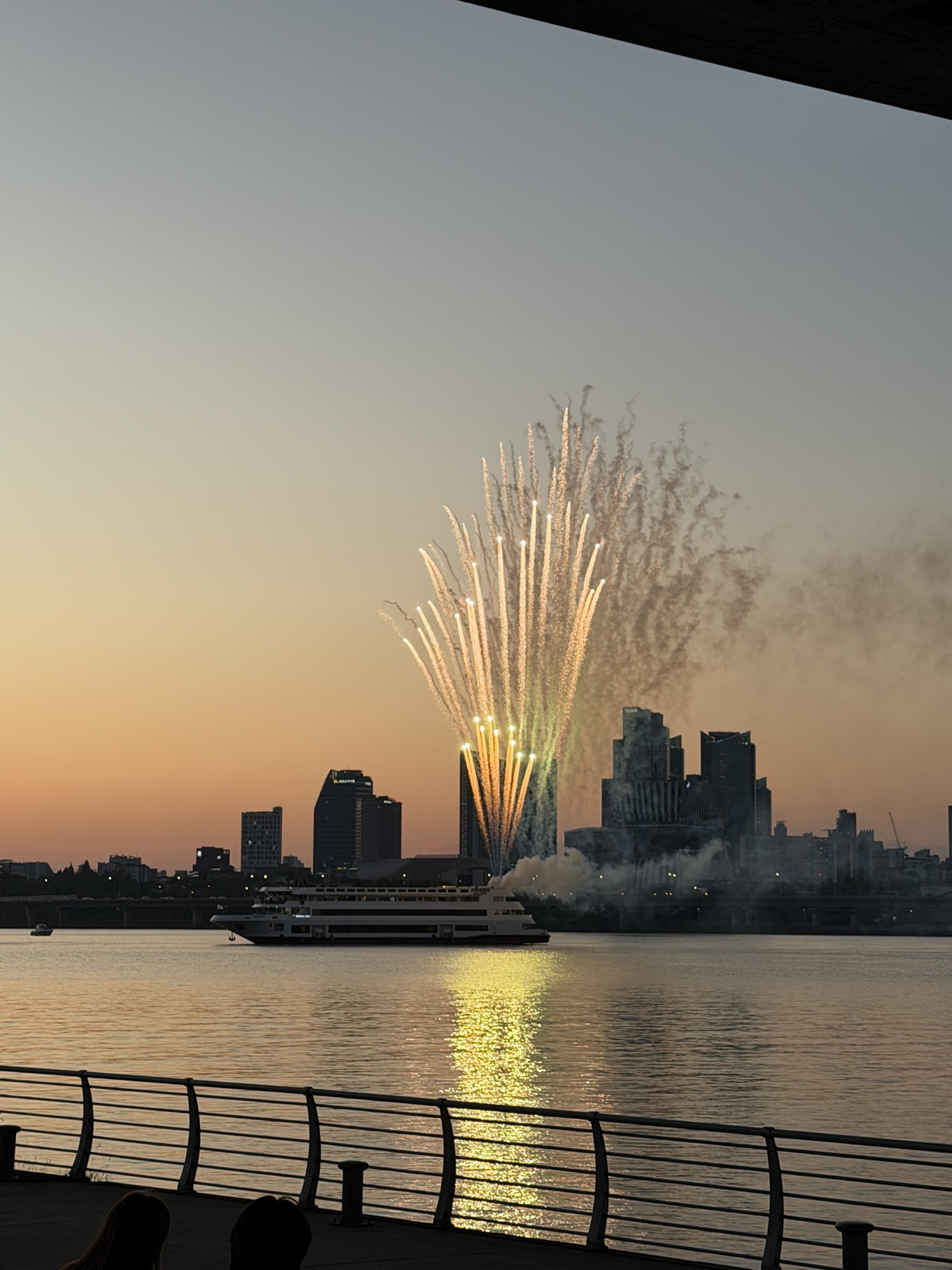 Evening fireworks seen from Yeouido Hangang Park near the riverside convenience store
