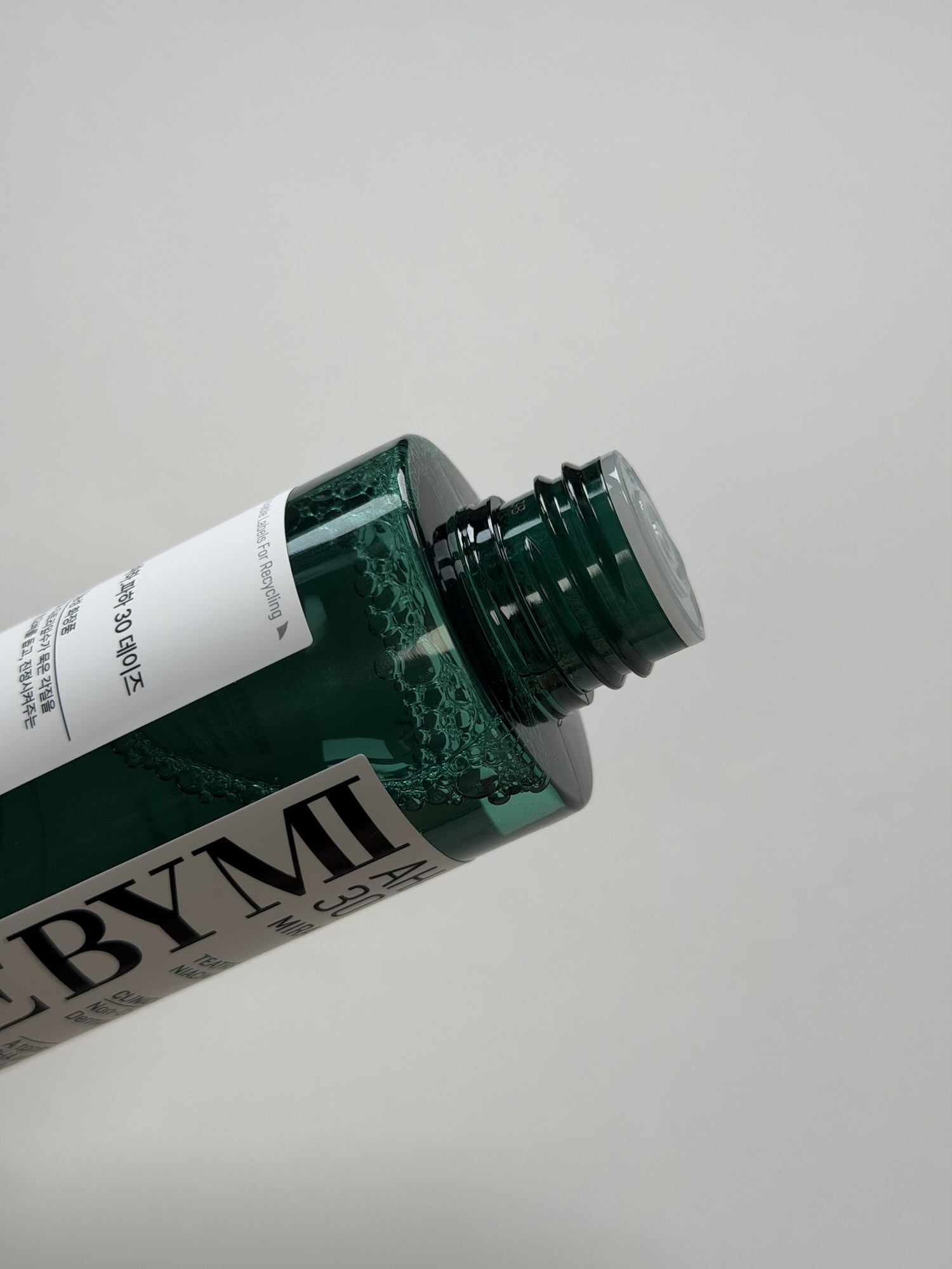 Close-up of the SOME BY MI Miracle Toner bottle opening for controlled drops