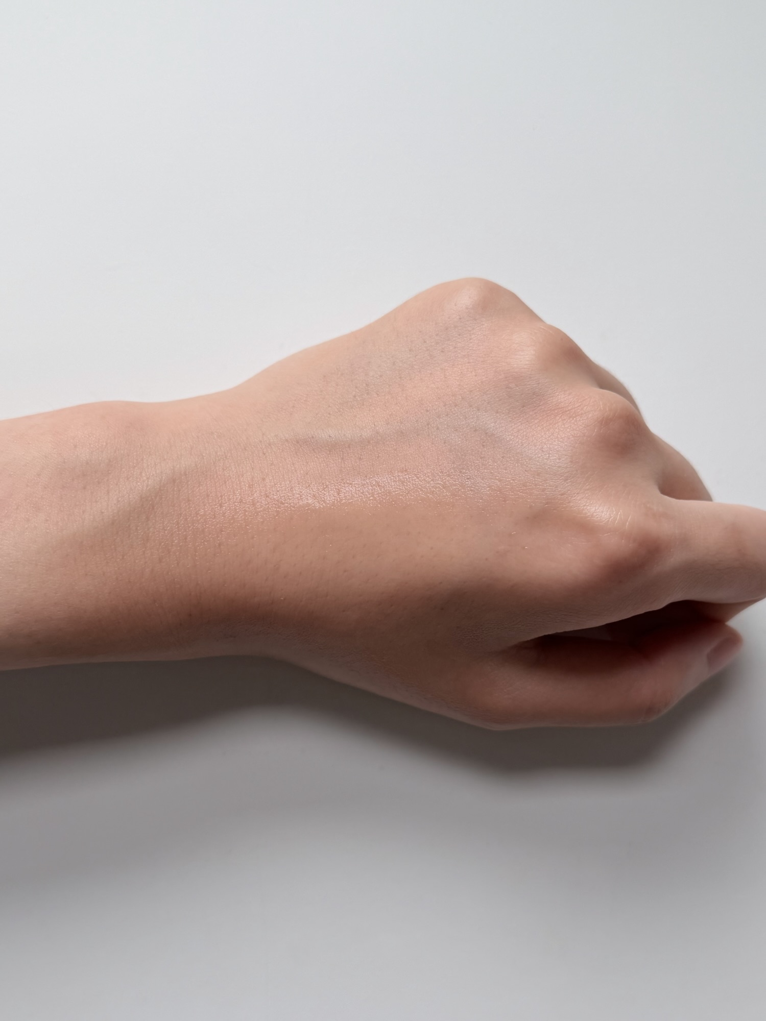 SOME BY MI Miracle Toner absorption test on the back of a hand with watery finish