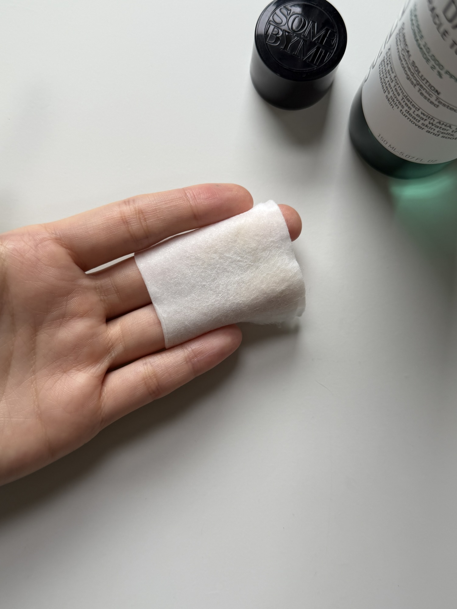 Cotton pad after wiping with SOME BY MI Miracle Toner showing light residue