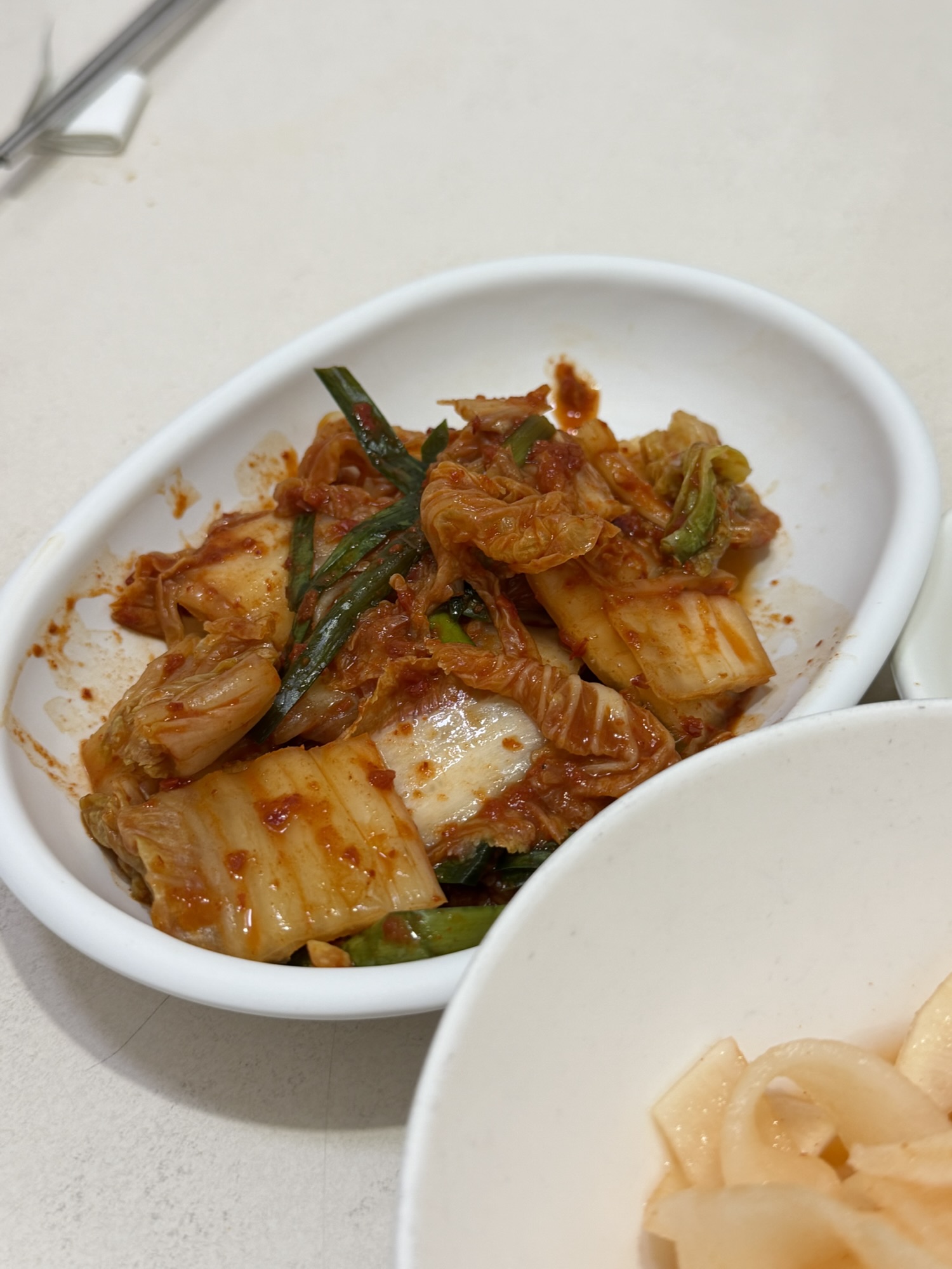 Kimchi side dish served with nokdujeon at Eulmildae