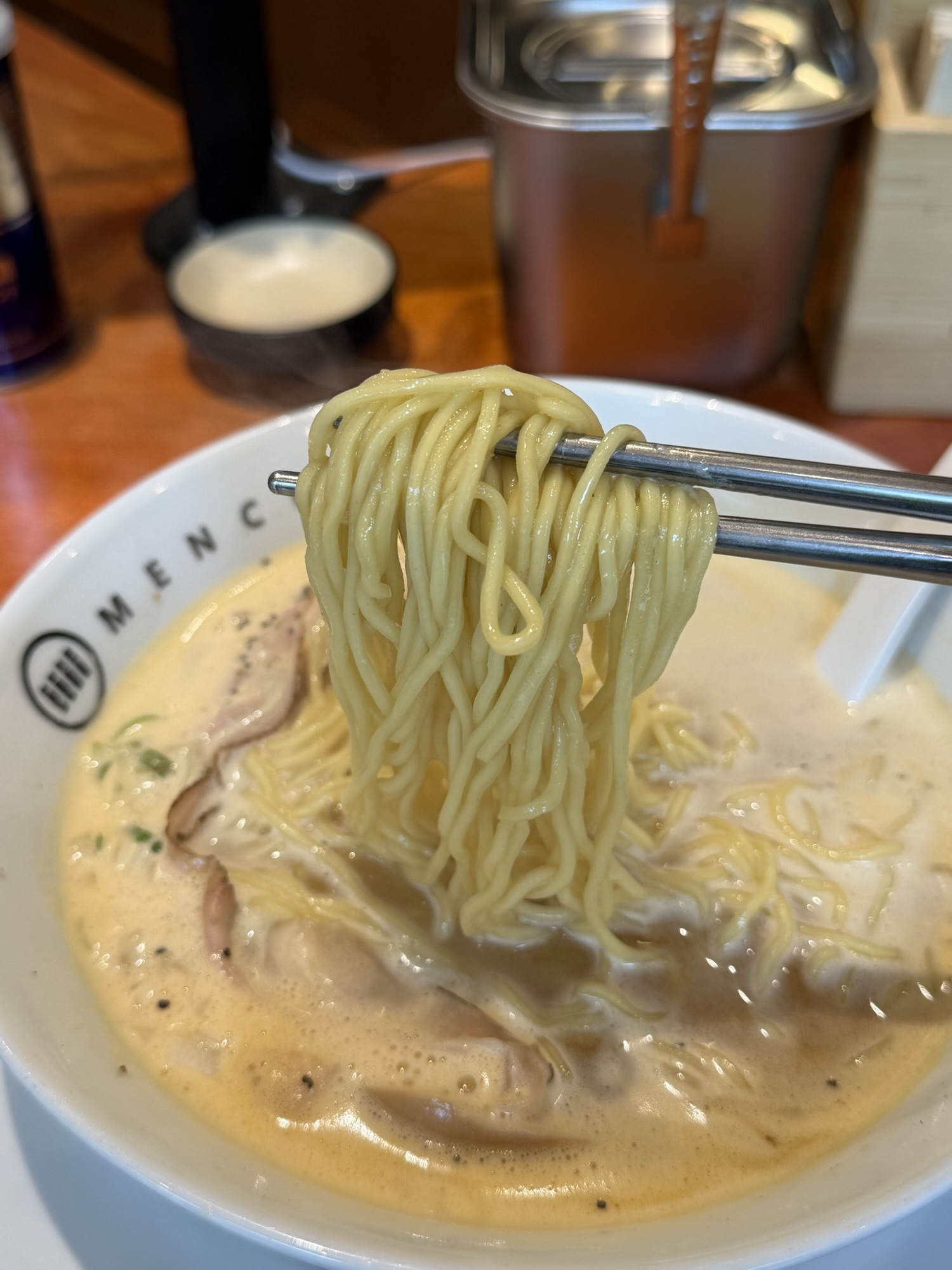 Noodles lifted from spicy paitan ramen at Menchuru Yeouido