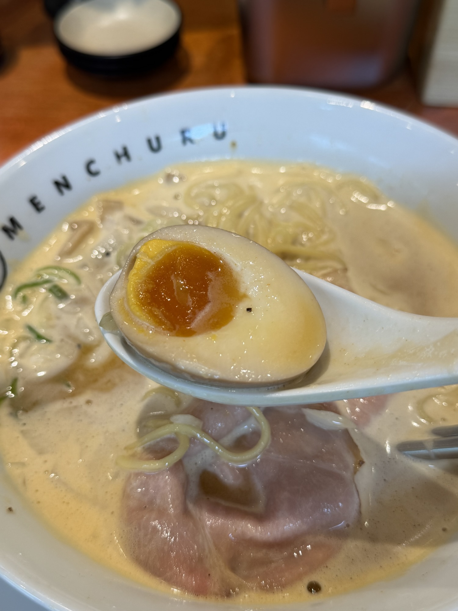 Onsen tamago served with spicy paitan ramen at Menchuru Yeouido