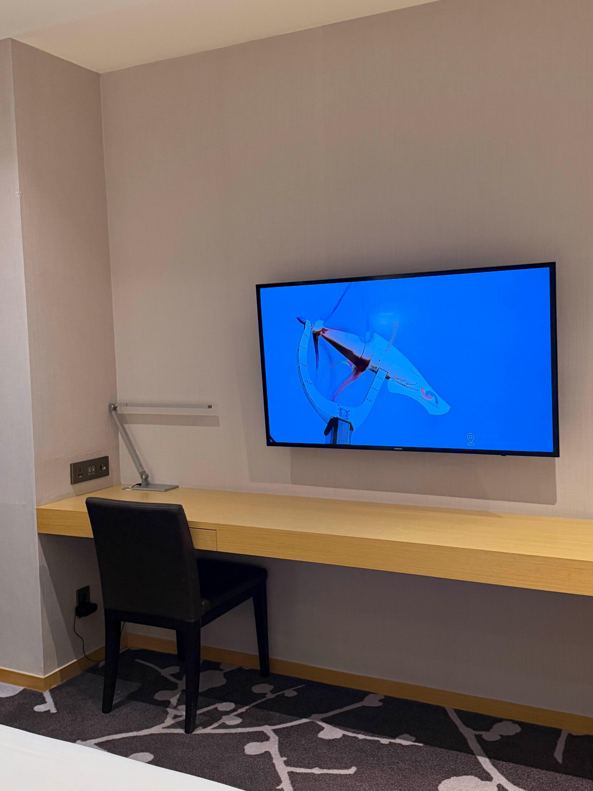 TV and chair area in Avani Central Busan room