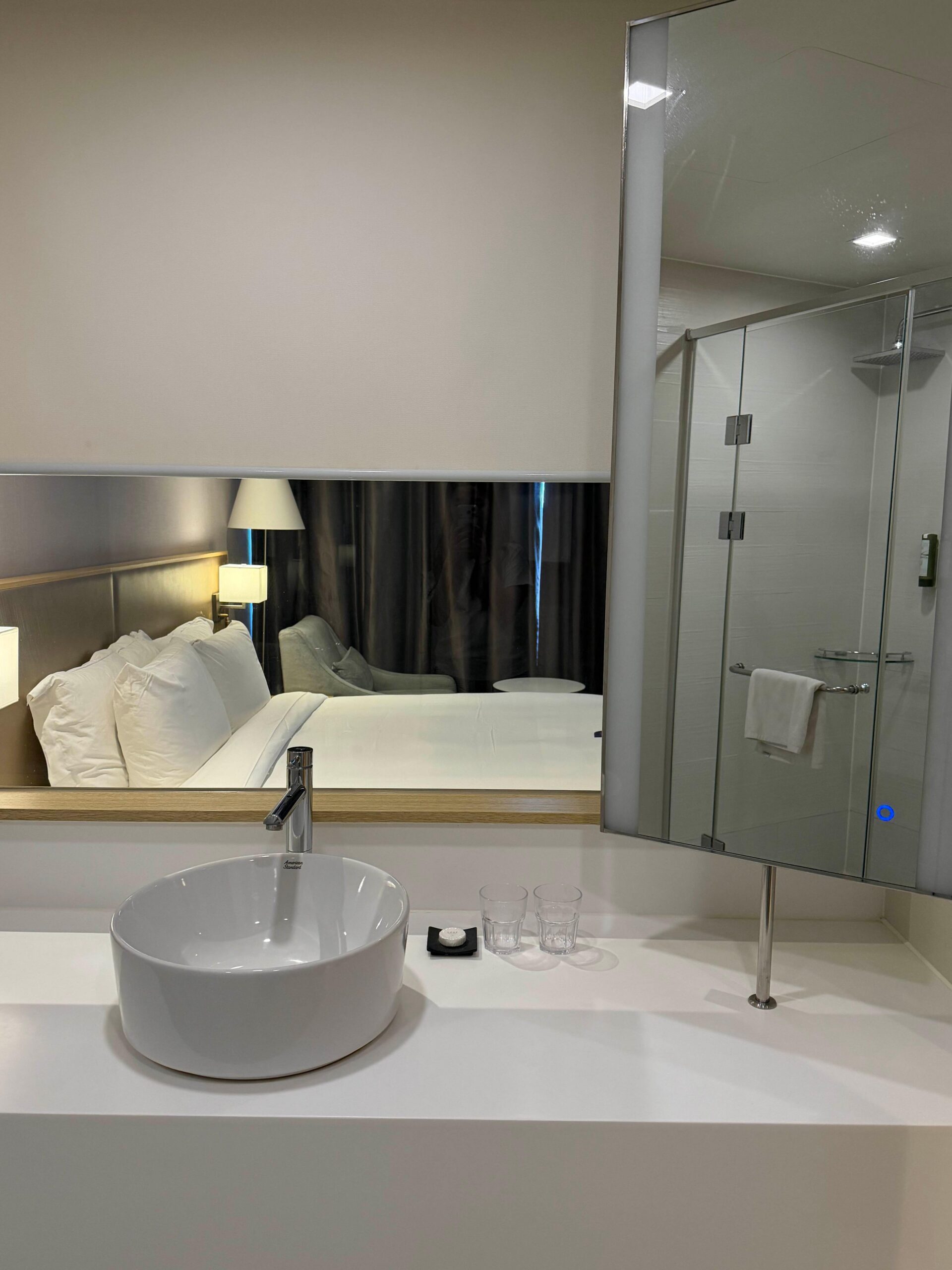 Bathroom sink and mirror at Avani Central Busan
