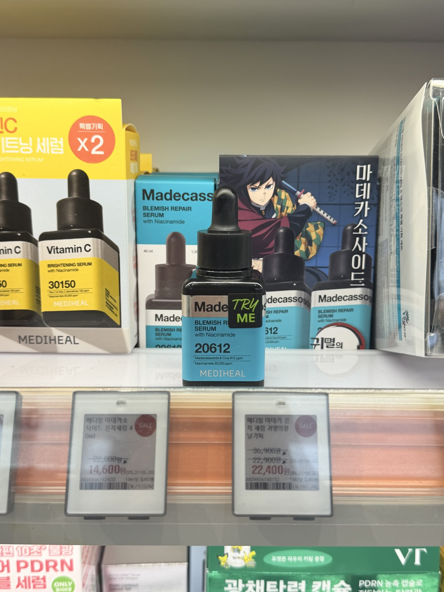 Mediheal Madecassoside Blemish Repair Serum on an Olive Young shelf with sale price tags