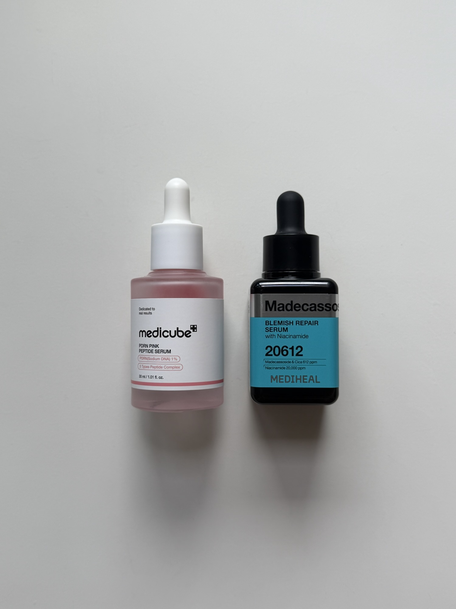 Medicube PDRN Pink Peptide Serum next to Mediheal Madecassoside Blemish Repair Serum