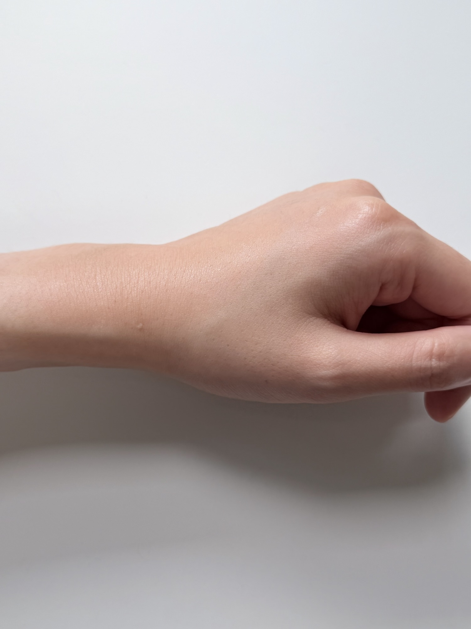 Back of hand after Mediheal Madecassoside serum has absorbed with a light finish