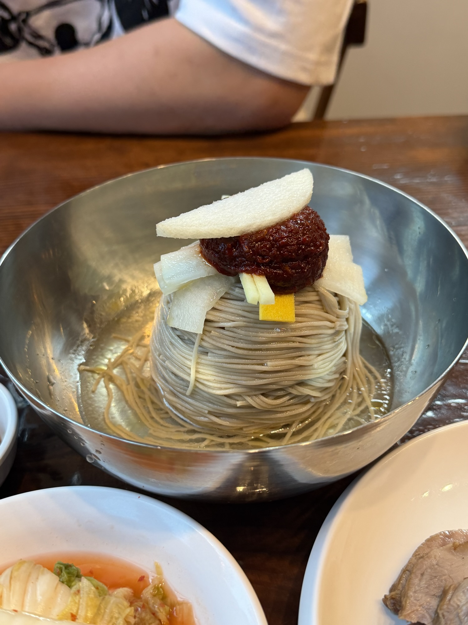 Bibim makguksu with spicy sauce, Korean pear, and buckwheat noodles at Gogiri Makguksu
