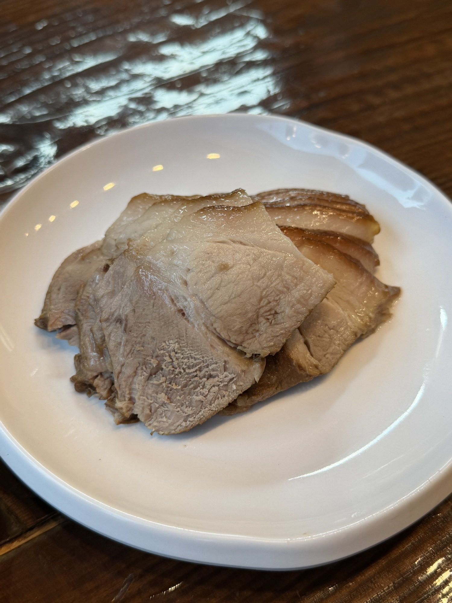 Plate of suyuk boiled pork slices at Gogiri Makguksu