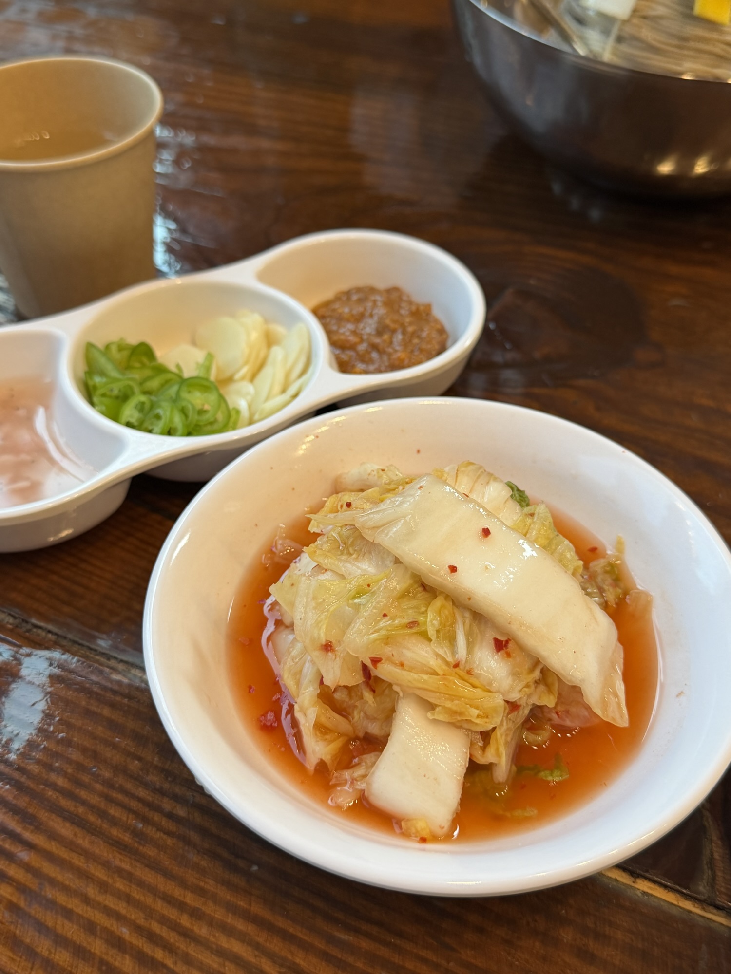 Water kimchi side dish served at Gogiri Makguksu