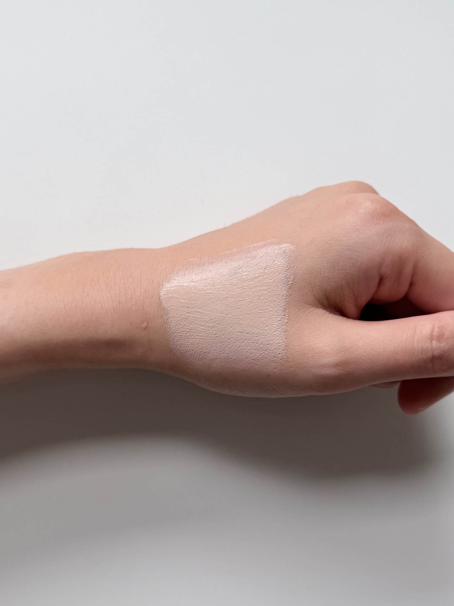 Goodal Sun BB cream partly spread on the back of a hand