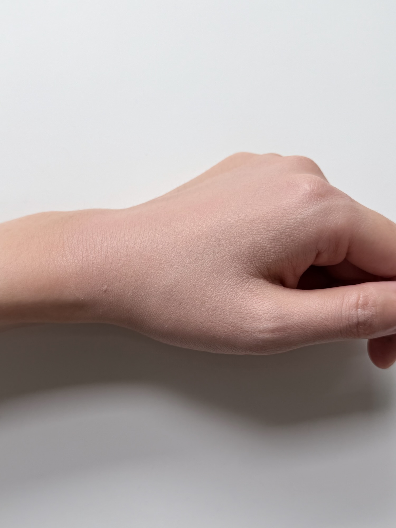 Goodal Sun BB cream blended into the back of a hand with a natural tone-up finish