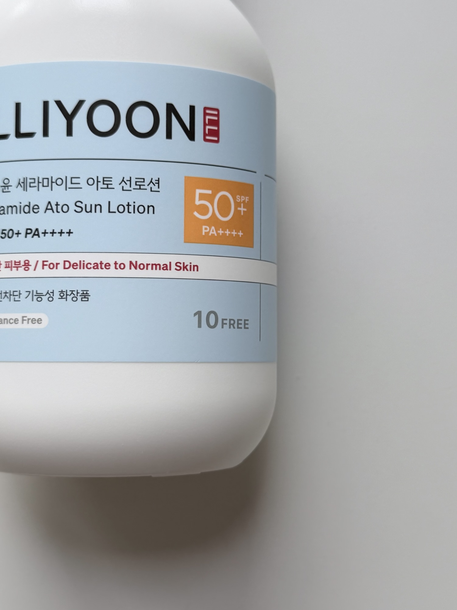 Close-up of ILLIYOON Ceramide Ato Sun Lotion label showing 10 free and SPF50 PA++++