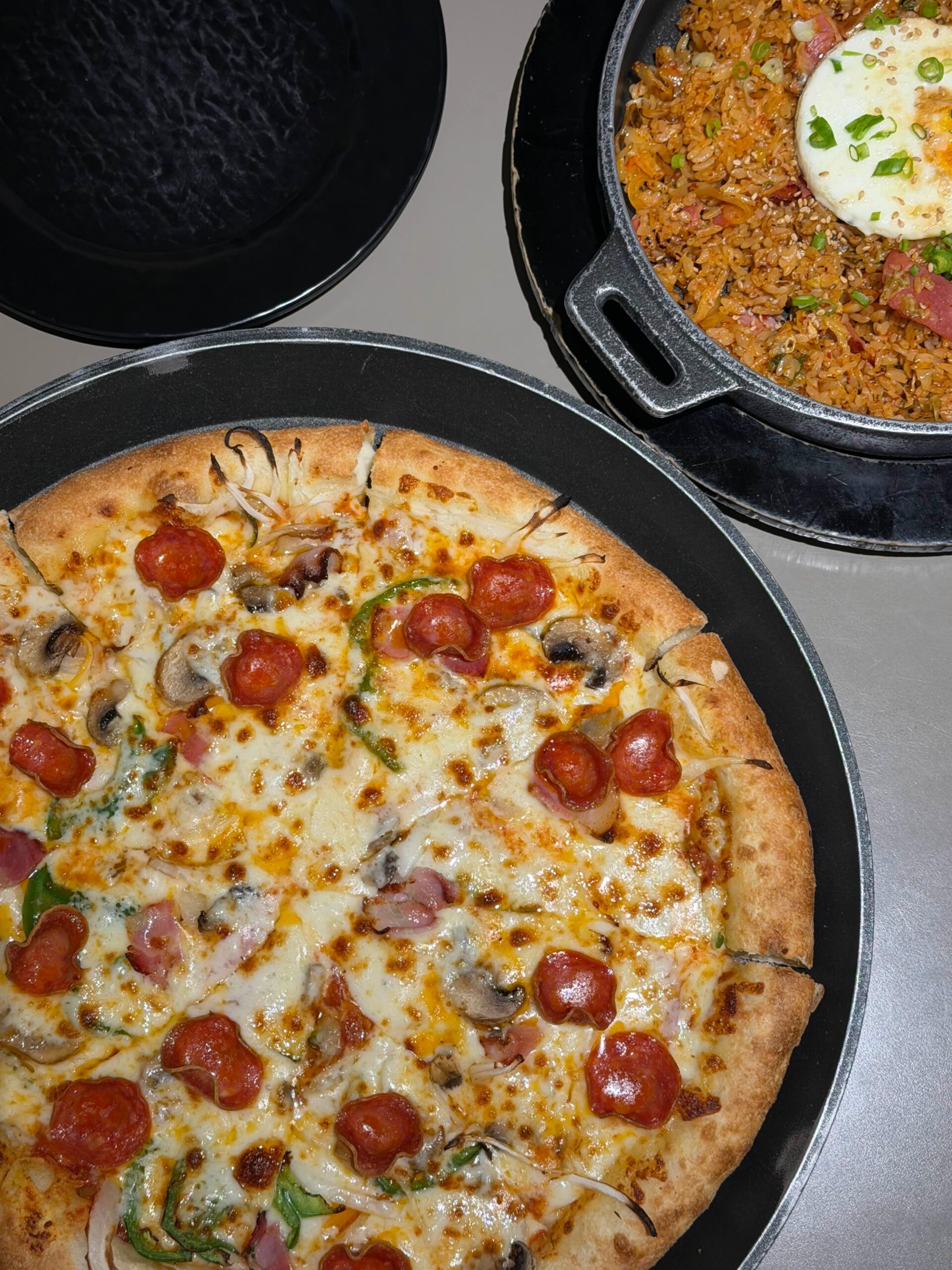 Lee Jaemo Pizza and kimchi fried rice served together