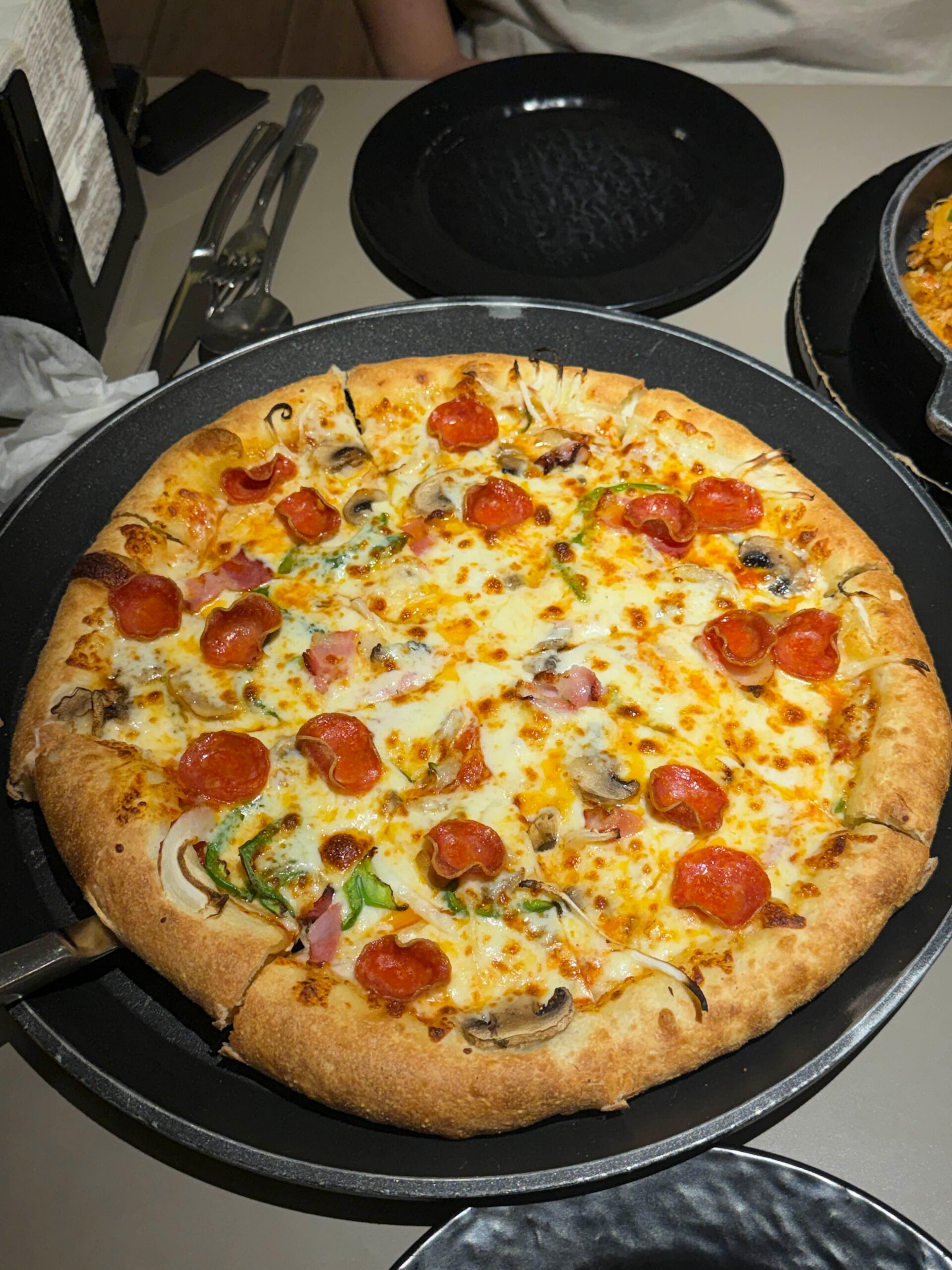 Large Lee Jaemo Crust pizza on the table