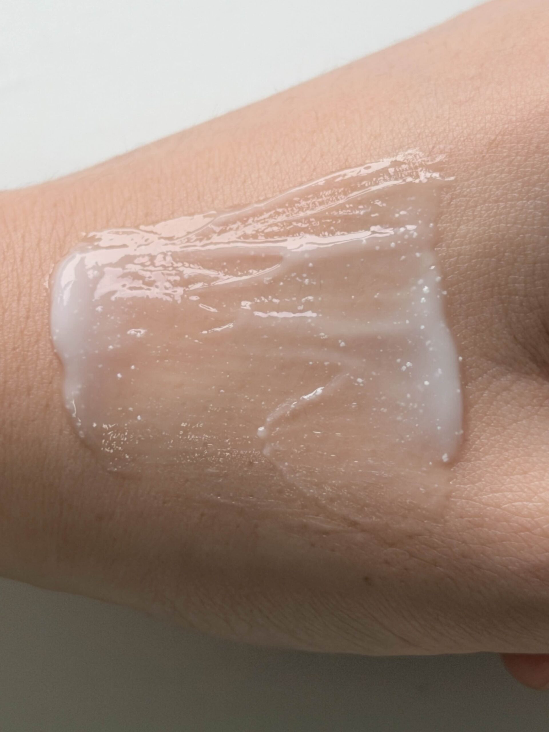Close-up of Aestura Atobarrier 365 Hydro Soothing Cream texture with visible white capsules