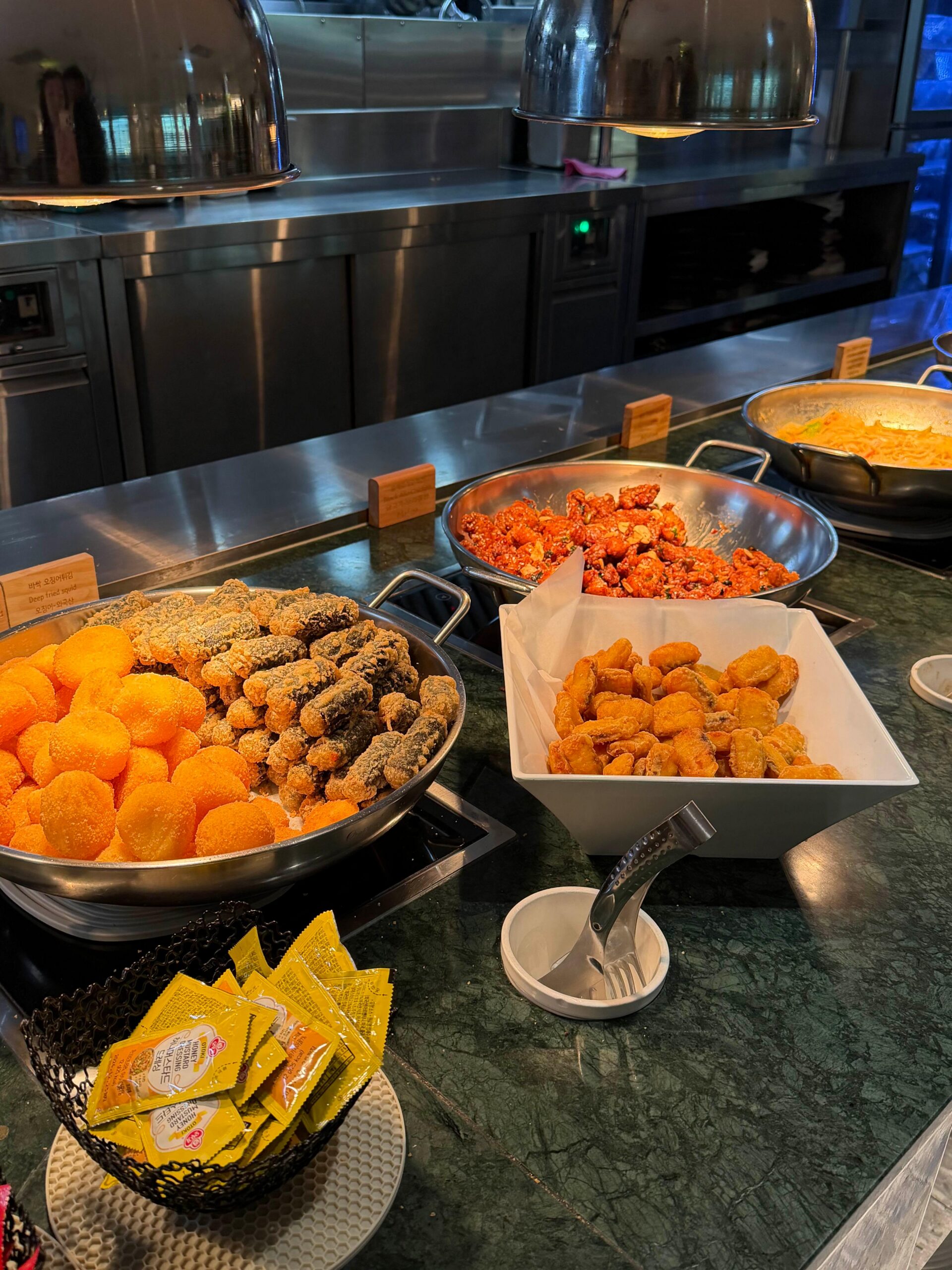 Hot food buffet station at Matina Lounge East
