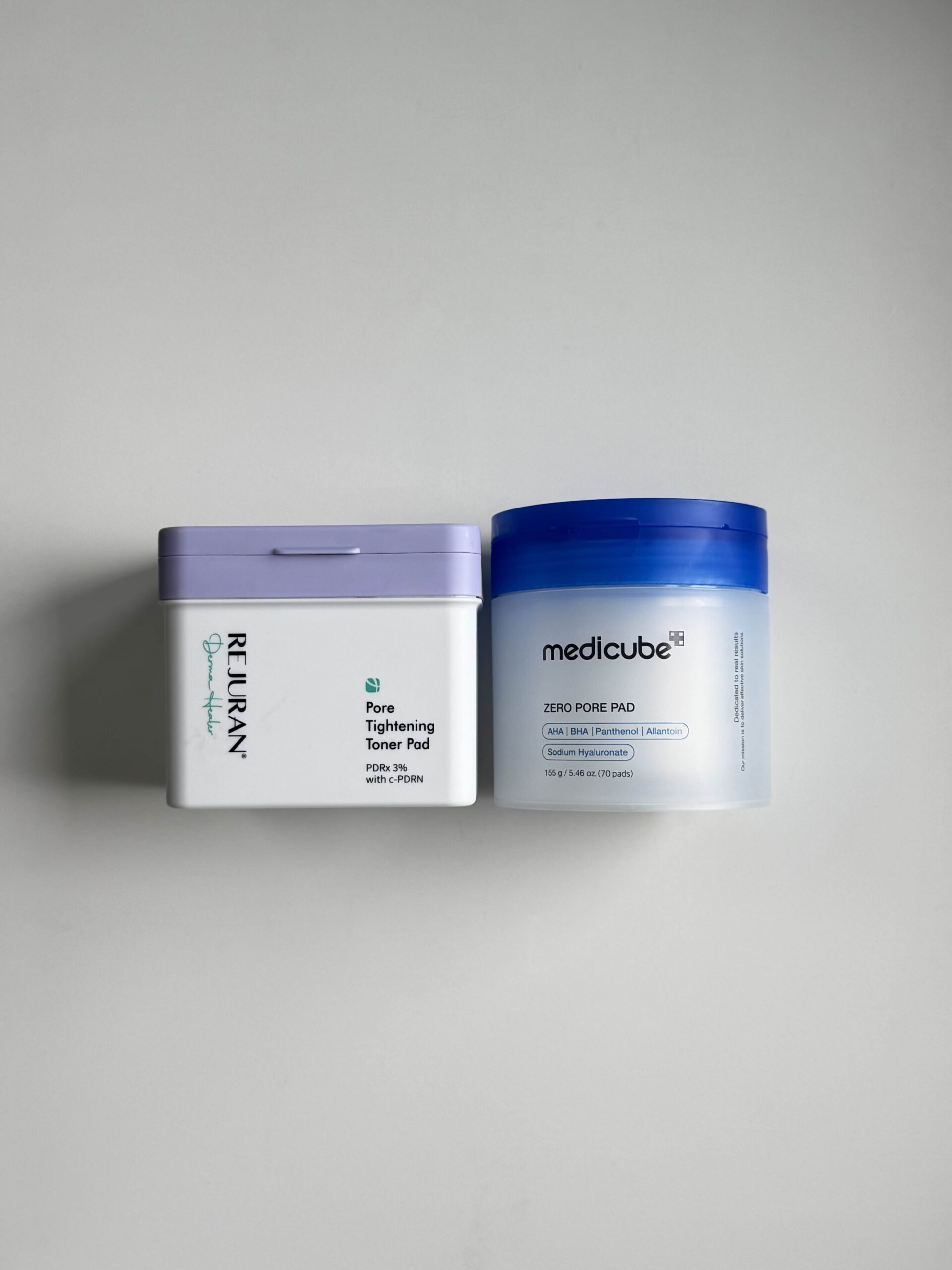 Medicube Zero Pore Pad 2.0 next to Rejuran toner pad box for comparison