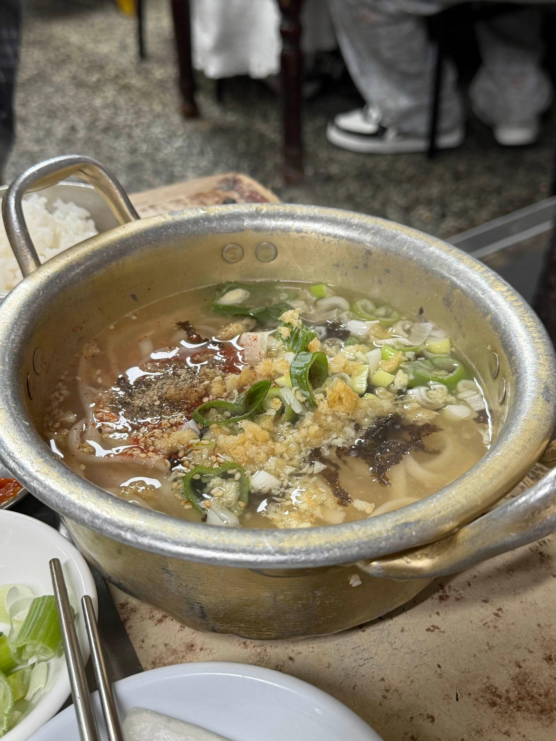 Kalguksu served in an aluminum pot at Sarangbang Kalguksu