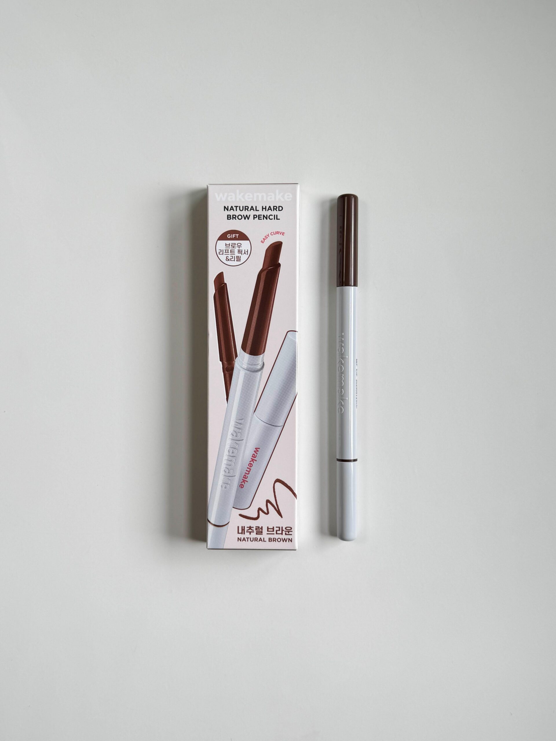 Wakemake Natural Hard Brow Pencil set with brow fixer on a white surface