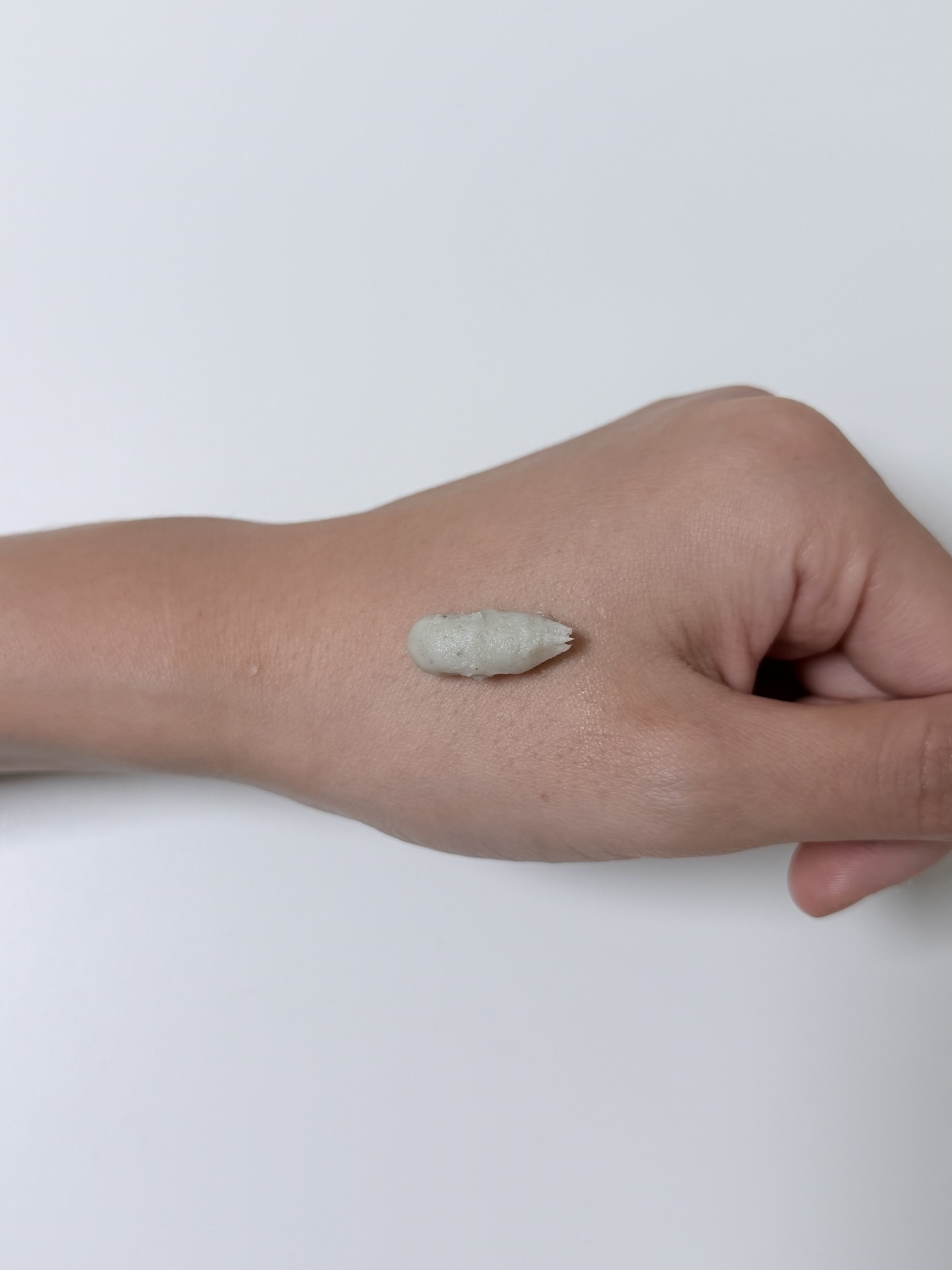 Thick cream texture of Beplain Mung Bean Cleansing Foam squeezed onto the back of a hand