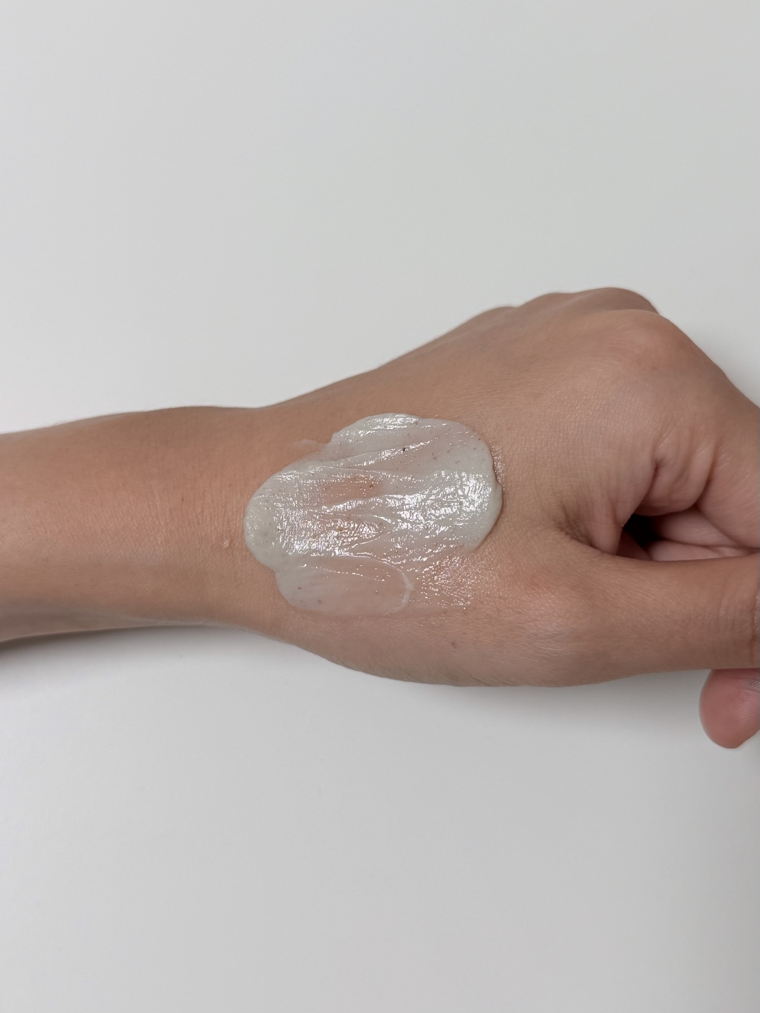Beplain Mung Bean Cleansing Foam spread on the back of a hand before adding water