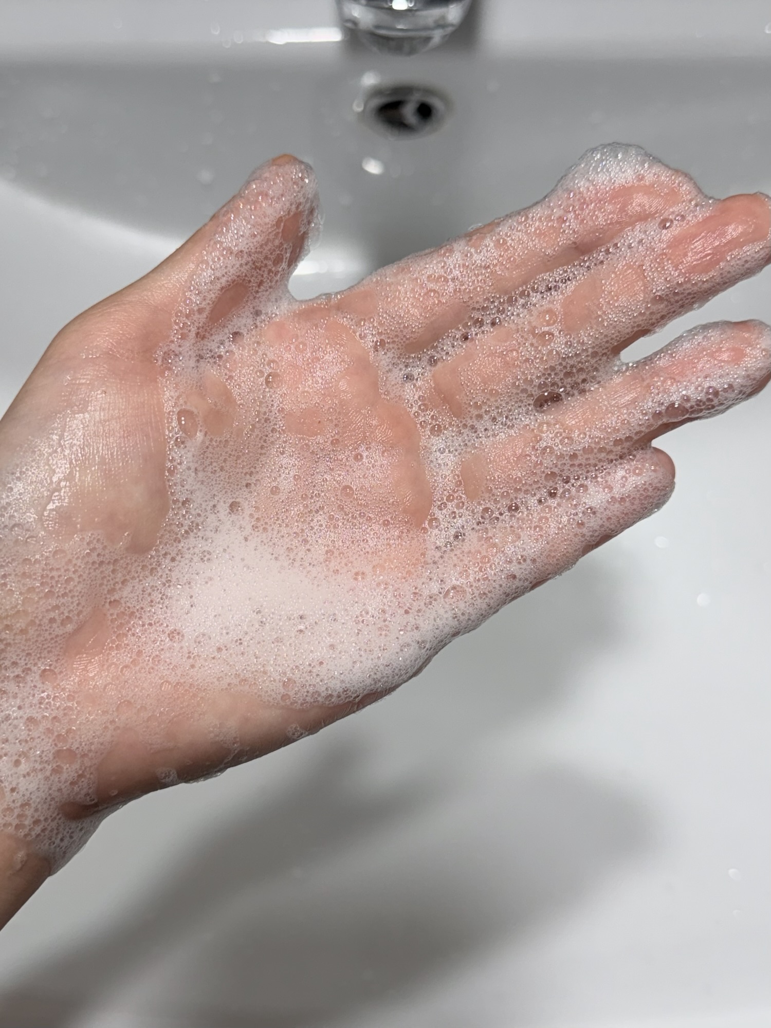 Beplain Mung Bean Cleansing Foam lathered with water on the palm