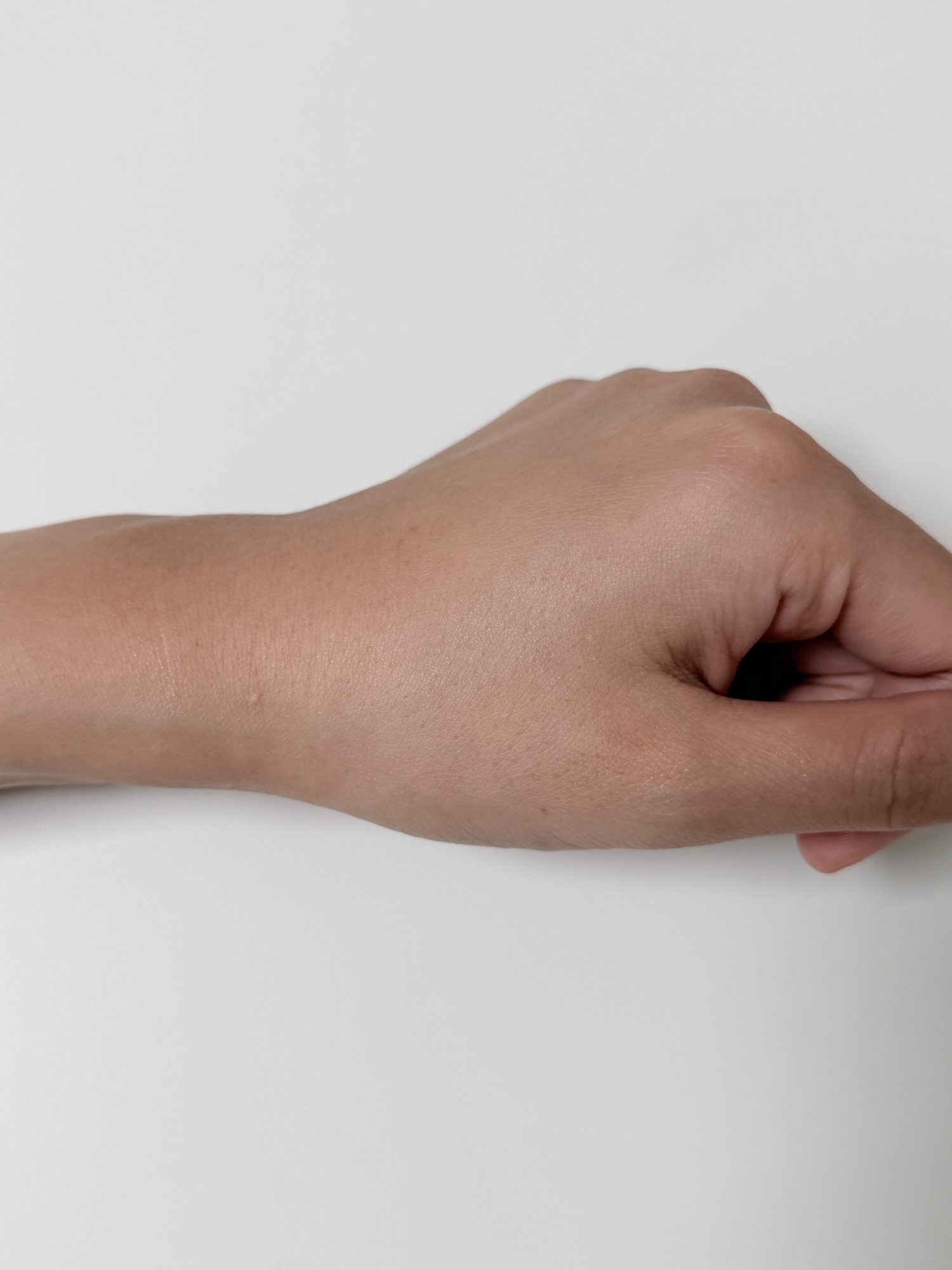 Back of hand after CNP TXA-PDRN Ampule has absorbed with a slightly glossy finish