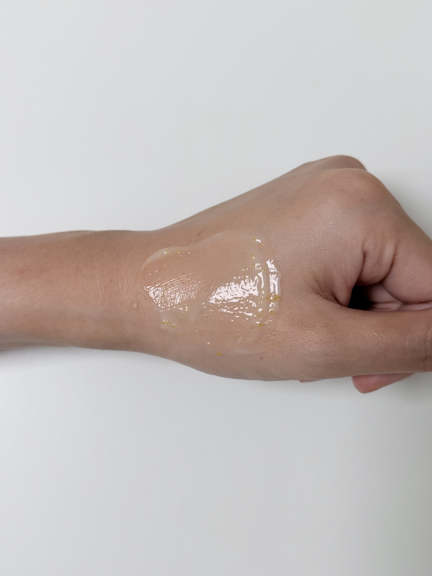 Goodal cream spread smoothly across the back of a hand