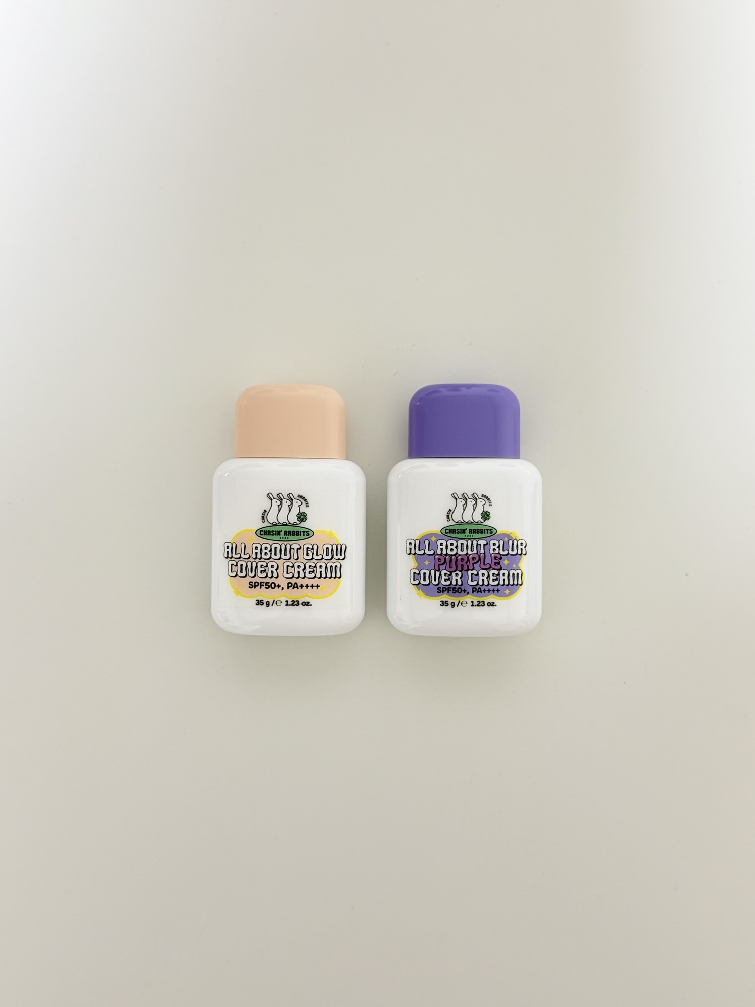 Chasin' Rabbits Glow Cover Cream and Purple Cover Cream side by side