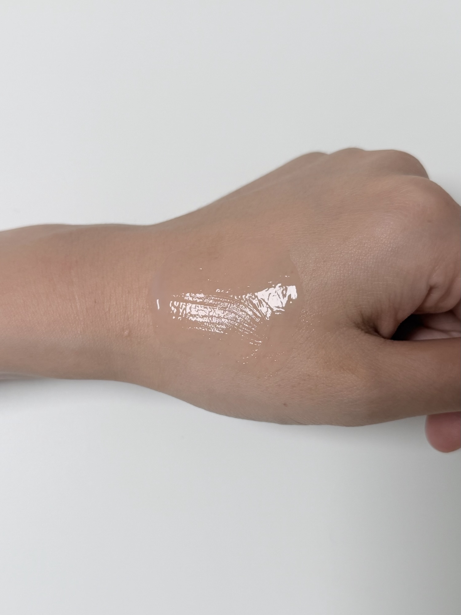 Isntree Onion Newpair gel cream being spread on the back of a hand