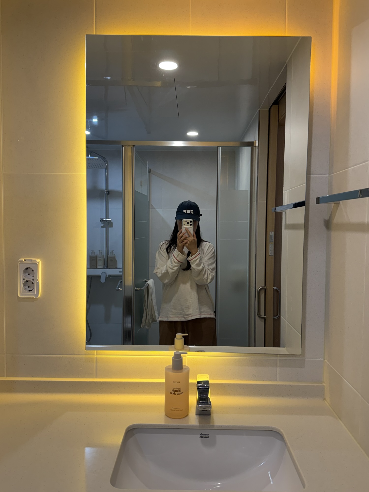 Sink and illuminated mirror in the Chestertons Gyeongju bathroom