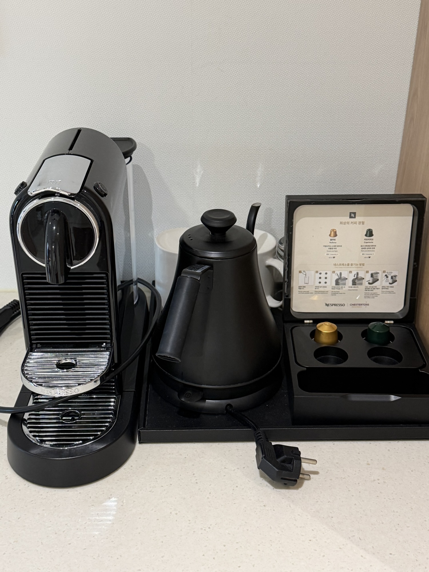 Nespresso machine, capsules, and kettle in the Chestertons Gyeongju room