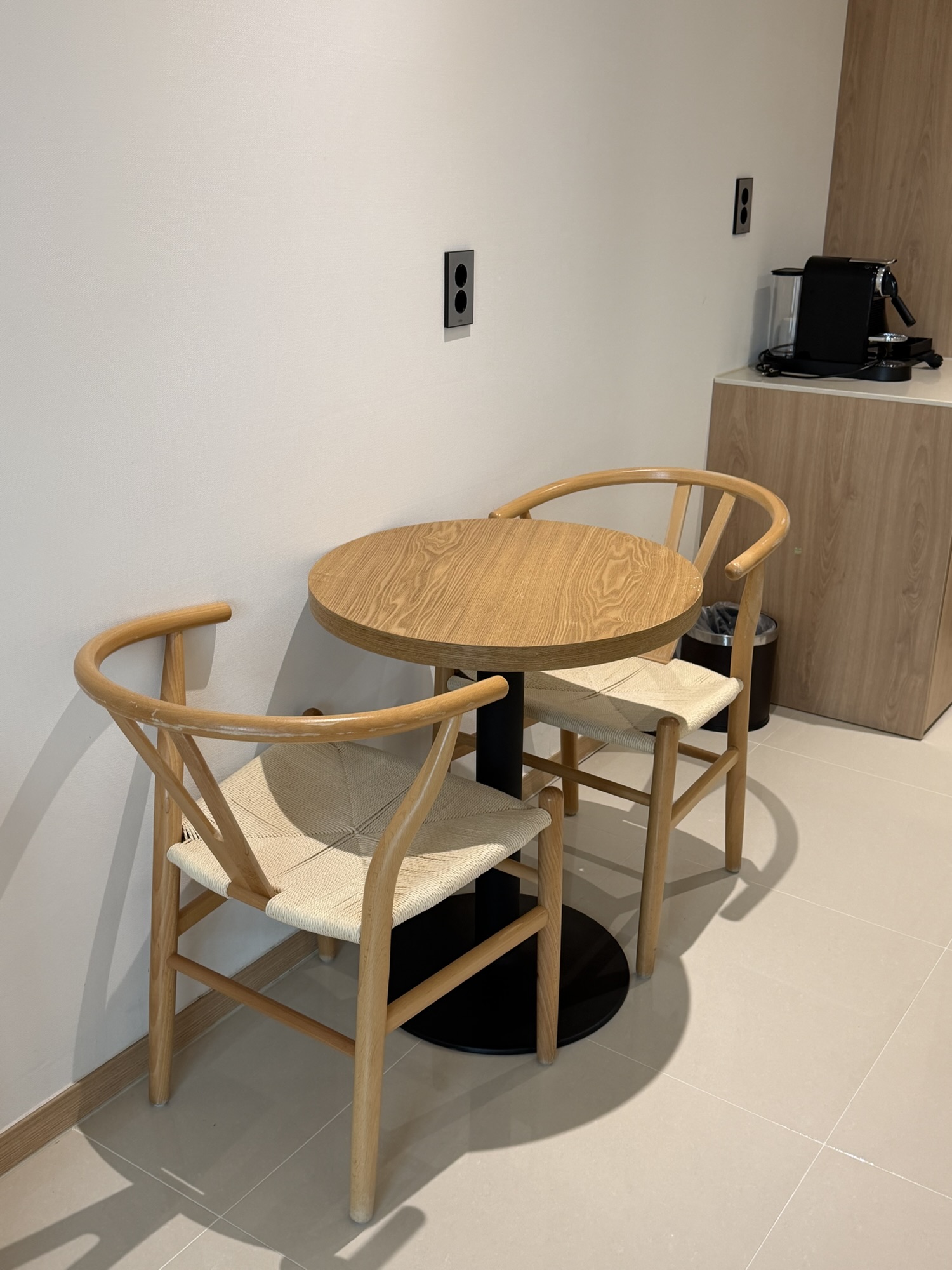 Small round table and two chairs in the Chestertons Gyeongju room