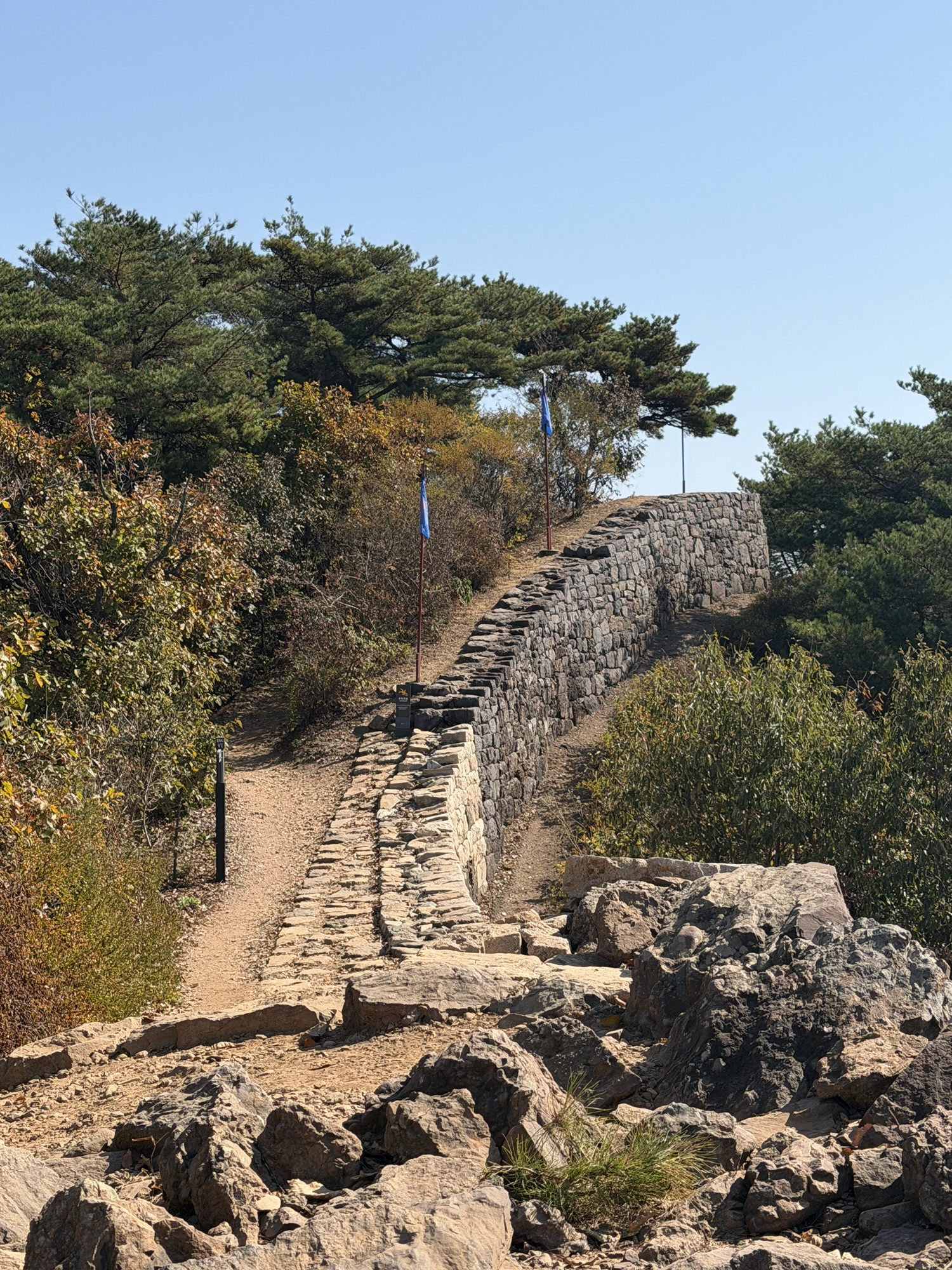 Stone wall of Munsusanseong Fortress beside the trail